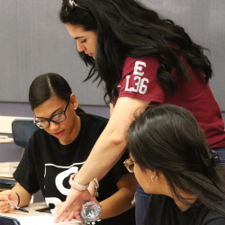 Aspire High staff helping students